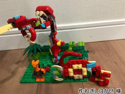 赤いヘビがトカゲを食べる図(れきしはかせ 様)