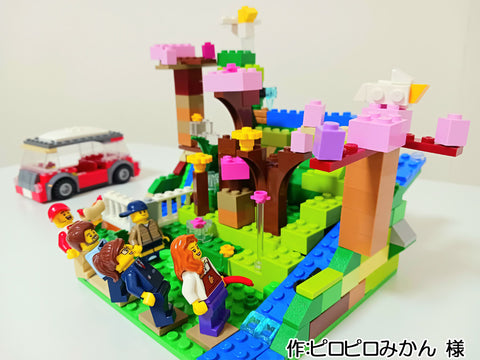 水の流れる公園でみんなでお花見(ピロピロみかん 様)